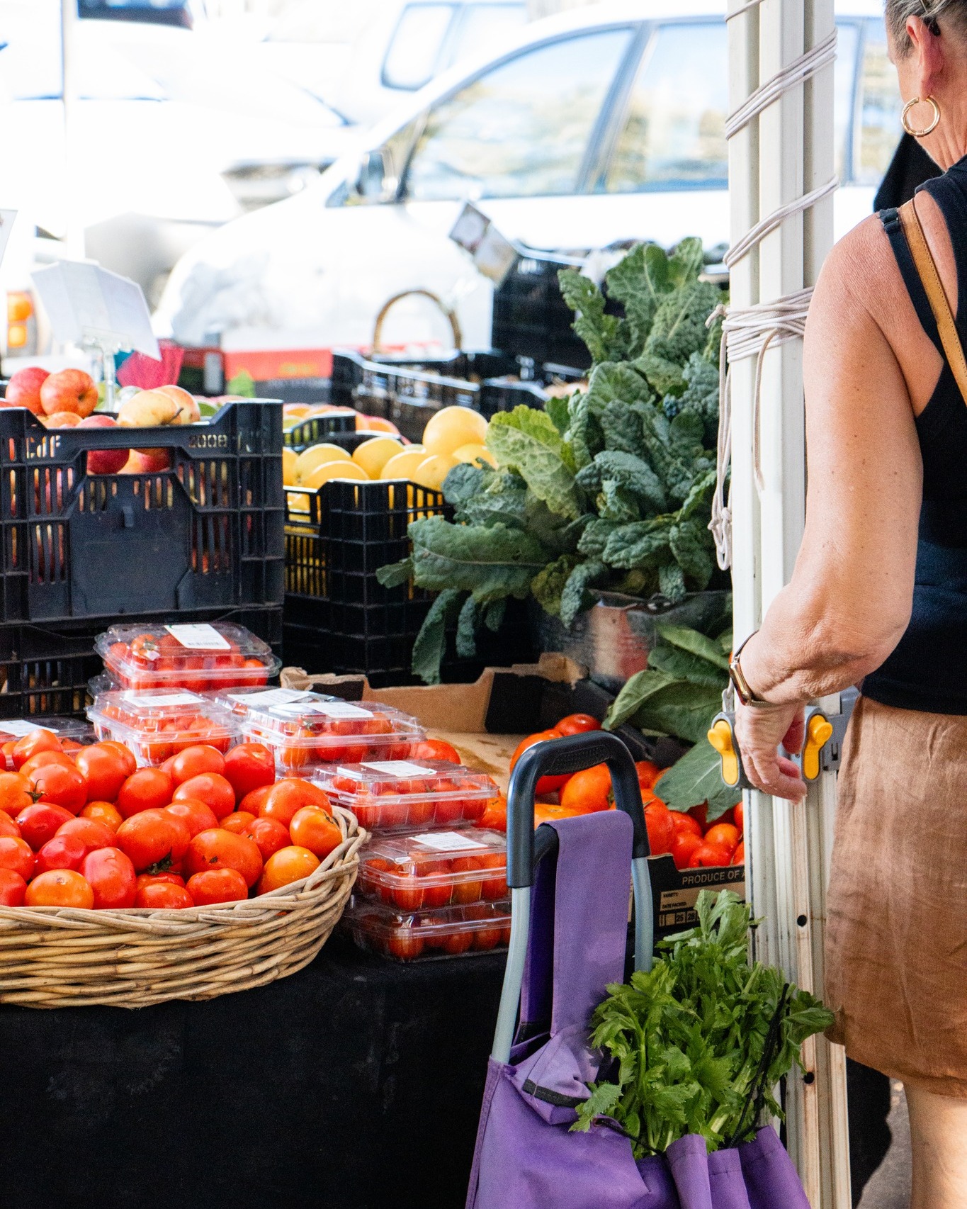 Woman shopping for fresh fruit and vegetables at market